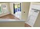 A view of the living space with tile and wood floors that connects to the kitchen with white cabinets at 250 Grand Oaks Dr, Ladson, SC 29456