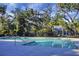 Community pool surrounded by trees, with a clear blue sky at 250 Grand Oaks Dr, Ladson, SC 29456