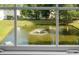 Window view of a pond and water fountain at 250 Grand Oaks Dr, Ladson, SC 29456