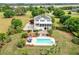 Aerial shot showcasing the backyard pool with surrounding lounge area and detailed landscaping at 2636 Anchor Watch Dr, Wadmalaw Island, SC 29487