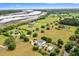 Stunning aerial view showcases multiple homes nestled on expansive green lawns near a picturesque river at 2636 Anchor Watch Dr, Wadmalaw Island, SC 29487