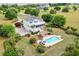 Expansive property featuring a two-story home, swimming pool, and lush landscaping at 2636 Anchor Watch Dr, Wadmalaw Island, SC 29487