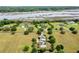 Expansive aerial of waterfront homes featuring beautifully manicured lawns and private docks along the river at 2636 Anchor Watch Dr, Wadmalaw Island, SC 29487