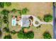 Aerial view of a beautiful home with a private pool, circular driveway, and expansive green yard at 2636 Anchor Watch Dr, Wadmalaw Island, SC 29487