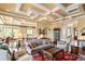 Spacious living room with coffered ceilings, hardwood floors, and open layout to kitchen at 2636 Anchor Watch Dr, Wadmalaw Island, SC 29487
