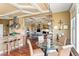 Open-concept living space showcases kitchen, breakfast nook and living room with fireplace at 2636 Anchor Watch Dr, Wadmalaw Island, SC 29487