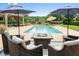 Pool area features a fire pit, lounge seating, umbrellas and a pergola covered seating area at 2636 Anchor Watch Dr, Wadmalaw Island, SC 29487