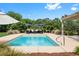 Inviting pool and outdoor space featuring comfortable lounge furniture and a cozy pergola-covered area at 2636 Anchor Watch Dr, Wadmalaw Island, SC 29487