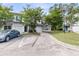Exterior view of the townhomes with attached garages and a parked car, offering convenient parking at 281 Jackson St, Goose Creek, SC 29445