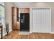 Kitchen features a black refrigerator and wood cabinets at 281 Jackson St, Goose Creek, SC 29445