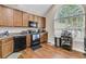 Kitchen with black appliances and a bar cart near the window at 281 Jackson St, Goose Creek, SC 29445