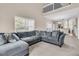 The living room includes a large sectional couch and a view of the upper level of this home at 281 Jackson St, Goose Creek, SC 29445