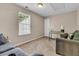 Cozy living room area with a sofa, a desk, and a window for natural light at 281 Jackson St, Goose Creek, SC 29445