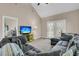 Spacious living room features a large sectional couch, vaulted ceiling, and bright natural light from patio doors at 281 Jackson St, Goose Creek, SC 29445