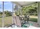 Enclosed patio featuring outdoor furniture, a ceiling fan, and a view of the yard and pond at 281 Jackson St, Goose Creek, SC 29445