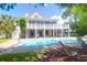 Gorgeous backyard with pool, patio, and deck, perfect for outdoor entertaining and relaxation at 3013 Middle St, Sullivans Island, SC 29482