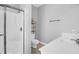 Clean bathroom featuring a shower, toilet, and marble sink at 3013 Middle St, Sullivans Island, SC 29482