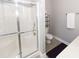 Modern bathroom featuring a stand-up shower with glass doors, white tile, and a vanity at 3013 Middle St, Sullivans Island, SC 29482