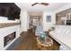 An airy living room featuring a fireplace, hardwood floors, and an open layout at 3013 Middle St, Sullivans Island, SC 29482
