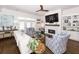 Bright living room with stylish decor, fireplace, and hardwood floors for comfortable living at 3013 Middle St, Sullivans Island, SC 29482