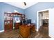 Bright home office with built-in shelving and wooden desk at 3013 Middle St, Sullivans Island, SC 29482