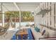 Inviting outdoor living space with a hammock, lounge seating, and a view of the private pool at 3013 Middle St, Sullivans Island, SC 29482