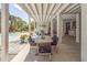 Under-house covered patio features outdoor dining, a hammock, and view of the pool and yard at 3013 Middle St, Sullivans Island, SC 29482