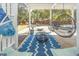 Covered patio with hanging chairs, a surfboard, and outdoor seating, perfect for entertaining at 3013 Middle St, Sullivans Island, SC 29482