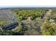 Magnificent aerial view of a waterfront property with a private dock surrounded by lush greenery and winding waterways at 3104 Upda Creek, Seabrook Island, SC 29455