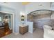 Elegant bathroom featuring a modern vanity, soaking tub, and a walk-in shower with decorative tiling at 3104 Upda Creek, Seabrook Island, SC 29455