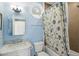 Bathroom with a shower-tub combo, marble countertop and neutral tiling at 3104 Upda Creek, Seabrook Island, SC 29455