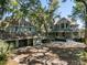 Stately home with a three-car garage, covered porches, and a sprawling driveway nestled among mature trees at 3104 Upda Creek, Seabrook Island, SC 29455