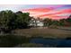 Elegant multi-story home surrounded by lush greenery with private dock and waterfront access at 3104 Upda Creek, Seabrook Island, SC 29455