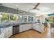 Bright kitchen featuring large windows, granite countertops, and stainless steel appliances at 3104 Upda Creek, Seabrook Island, SC 29455