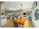Bright living area featuring a wooden table, kitchen island, and a cozy seating area with a fireplace at 3104 Upda Creek, Seabrook Island, SC 29455