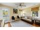 Cozy living room with a comfortable sofa, a ceiling fan, and a picturesque view from a window at 3104 Upda Creek, Seabrook Island, SC 29455