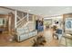 Bright and airy living room with wood paneling, hardwood floors and ample natural light at 3104 Upda Creek, Seabrook Island, SC 29455