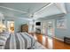 Spacious main bedroom with a king-sized bed, ceiling fan, and access to a private balcony at 3104 Upda Creek, Seabrook Island, SC 29455