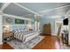 Comfortable main bedroom features a king-sized bed and a ceiling fan at 3104 Upda Creek, Seabrook Island, SC 29455