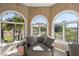 Inviting sitting area with large arched windows overlooking the beautiful marsh views at 3104 Upda Creek, Seabrook Island, SC 29455