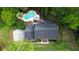 Stunning aerial view of a home with a private pool surrounded by lush greenery and mature trees at 312 E Shepard Ln, Summerville, SC 29483