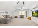 Spacious bonus room features carpet and seating at 312 E Shepard Ln, Summerville, SC 29483