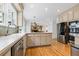 Updated kitchen features stainless steel appliances and view to living space at 312 E Shepard Ln, Summerville, SC 29483
