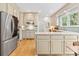 Bright kitchen featuring stainless steel appliances and tile backsplash at 312 E Shepard Ln, Summerville, SC 29483