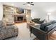 Inviting living room featuring a brick fireplace, built-in shelving, and stylish furniture at 312 E Shepard Ln, Summerville, SC 29483