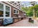 Outdoor kitchen with a grill, countertop space, and stainless steel appliances is perfect for outdoor dining at 312 E Shepard Ln, Summerville, SC 29483