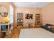 Cozy playroom with pastel walls, hardwood floors, and a variety of toys and books at 312 E Shepard Ln, Summerville, SC 29483