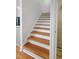 Staircase with hardwood treads and white risers at 312 E Shepard Ln, Summerville, SC 29483