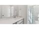 Clean, well-lit bathroom with modern fixtures and a shower featuring a striped curtain at 314 Archar St, Summerville, SC 29486