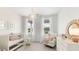 Serene Bedroom bathed in natural light, featuring a crib, armchair, and charming decor at 314 Archar St, Summerville, SC 29486
